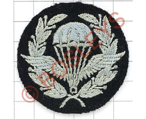RAF WW2 rare early trial pattern Parachute Instructor's cloth arm badge.Laurel wreath with winged parachute in light blue emb