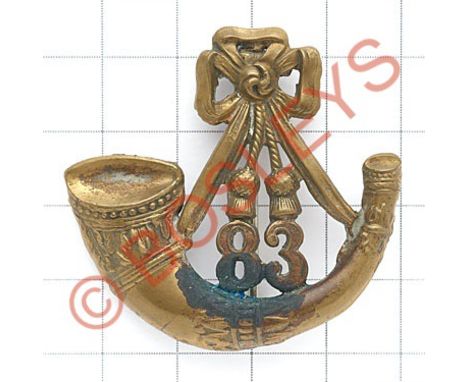 Indian Army. 83rd Wallajahbad Light Infantry brass pagri badge circa 1903-22.Die-stamped strung bugle with '83' lodged betwee
