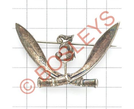 Indian Army. 3rd Gurkha Rifles Officer's head-dress badge.Die-stamped silvered crossed kukris adapted with separate '3' attac