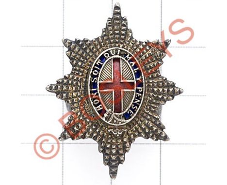 Coldstream Guards silver Officer's Service Dress cap badge.Die-cast facetted Garter Star mounted with pierced Garter on a blu