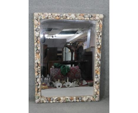 A large vintage seashell framed wall mirror with rope border. H.124 W.90cm 