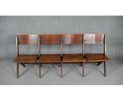 A set of four vintage oak folding church or cinema seats. H.80 W.187 D.67cm 