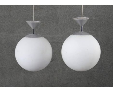 A pair of vintage white frosted glass spherical ceiling lights with chrome fittings. Diam.30cm 
