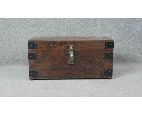 A C.1900 iron bound travelling trunk with twin carrying handles. H.25 W.49 D.28cm 