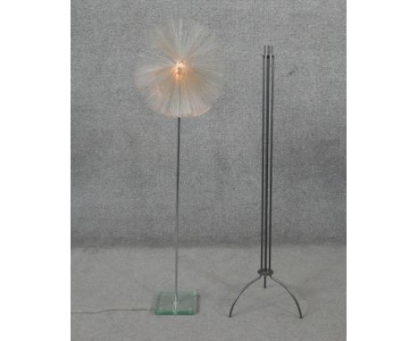 A large abstract wrought iron floor standing tripod candlestick along with a vintage fibre optic globe floor standing light w