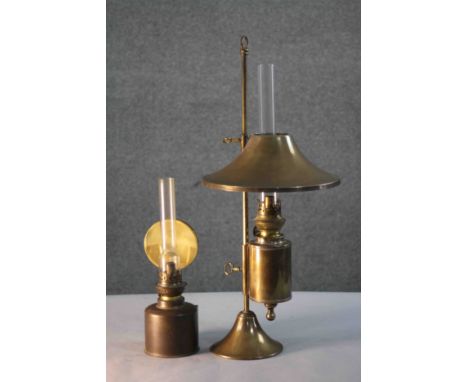 Two brass oil lamps. One Kosmos Brenner brass oil table lamp with conical brass shade, glass funnel and on a brass stand, the