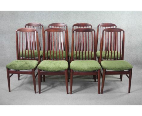 A set of eight vintage dining chairs by Benny Linden with splat backs raised on shaped stretchered supports. 