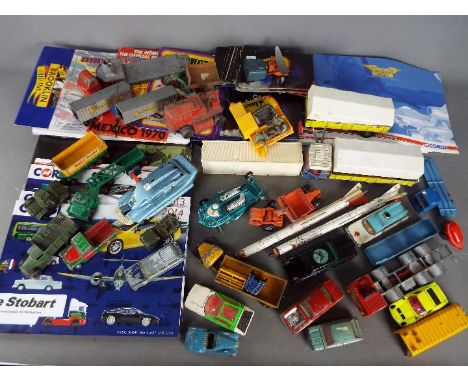 Dinky Toys, Matchbox, Corgi, Other - An unboxed group of over 20 diecast model vehicles and accessories, with a collection of