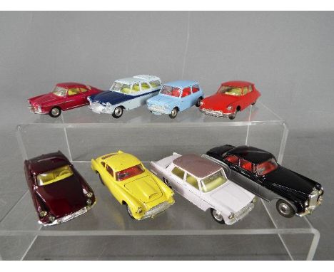 Corgi Toys - A collection of 8 unboxed diecast Corgi Toys. Lot includes Corgi Toys #226 Mini-Minor (pale blue body, red inter