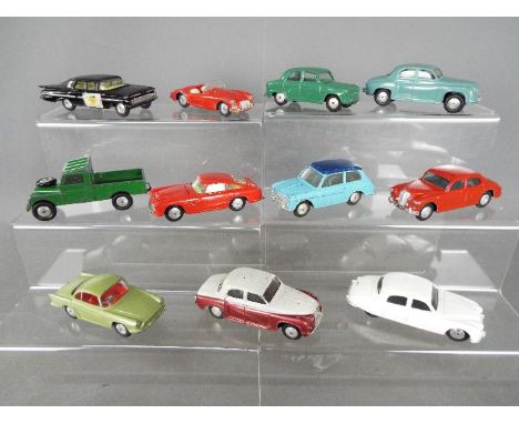 Corgi Toys - A collection of 11 unboxed diecast Corgi Toys. Lot includes Corgi Toys #218 Aston Martin DB4 (red body, flat spu