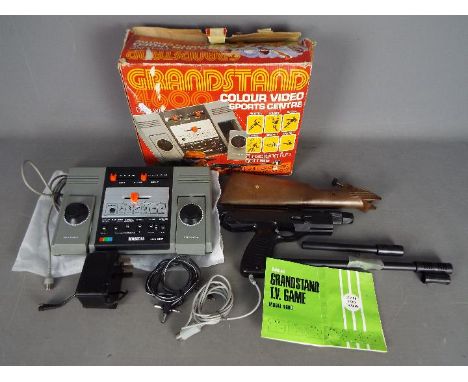 Adman - A boxed vintage Adman Grandstand 4600 Deluxe TV Game Consle with power pack and shooting game accessories. The consol