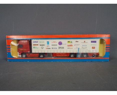 Tekno - A boxed Tekno #78 diecast 1:50 scale DAF Curtainside from 'The British Collection'. The model with red cab and charit