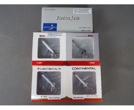 Three boxed two piece diecast model aircraft sets in 1:400 scale. Lot consists of Retro Jets DC9 Pacific Southwest Airlines N