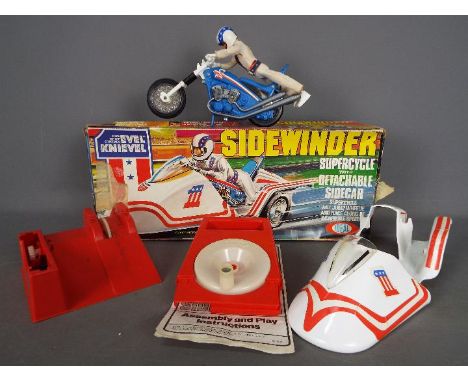 Ideal - A rare boxed Evel Knievel 'Sidewinder Supercycle' by Ideal. The lot includes Evel Knievel figure with Supercycle, det
