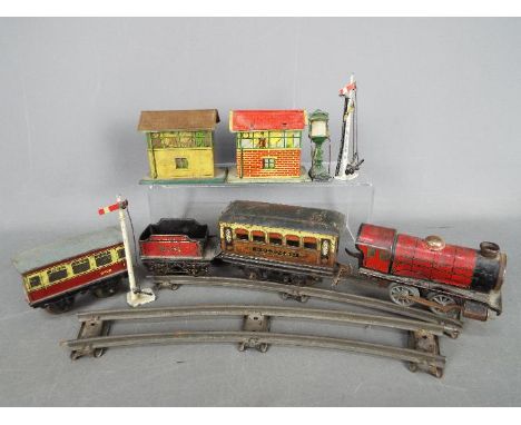 Hornby, Crescent, Brimtoy - A small collection of tinplate and clockwork toys. Lot includes a Hornby O gauge 0-4-0 clockwork 