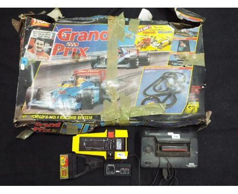 Lot to include a Tyco Racing Grand Prix set, unchecked for completeness, contained in original, poor box, a Sega Master Syste