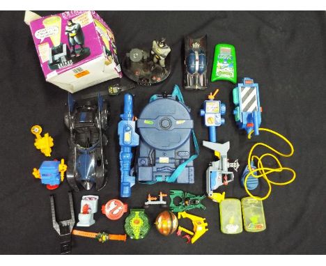 A Ghostbusters Proton Pack playset, Batman vehicles and talking alarm clock, Konami Teenage Mutant Hero / Ninja Turtles hand 