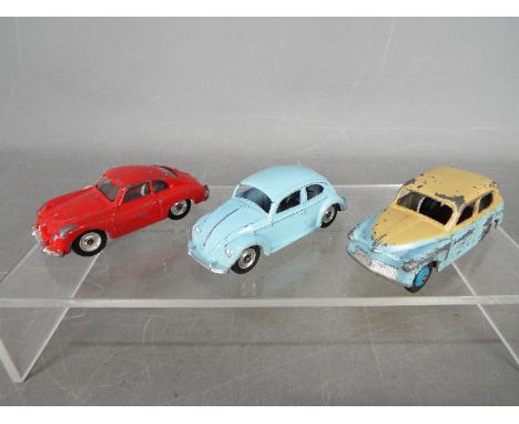 Dinky Toys - Three unboxed Dinky Toys. Lot includes an unusual two tone colour variant of Dinky Toys #154 Hillman Minx with l