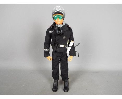 Action Man, Palitoy - An unboxed Palitoy Action Man 'Panzer Commander'. The blond flock hair Action Man has Eagle Eyes, gripp