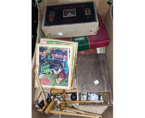 A child's china tea set and toilet set; a table top croquet set; a selection of vintage boxed games 