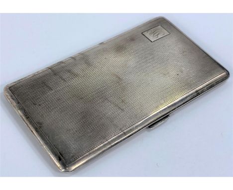 An engine turned monogrammed hallmarked silver cigarette case. Birmingham 1943, 7.8oz 