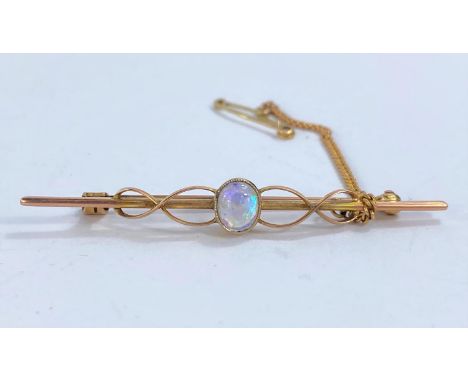A 9ct gold bar brooch set with oval opal to centre in original box, 3.2gms 