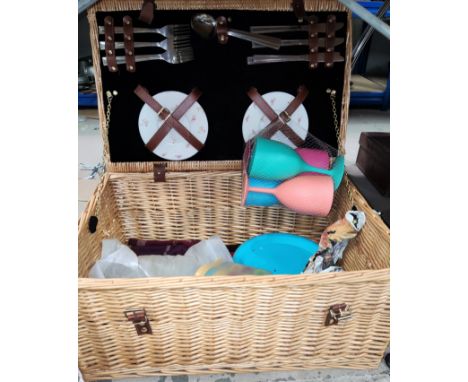 A wicker picnic hamper with fittings and another 