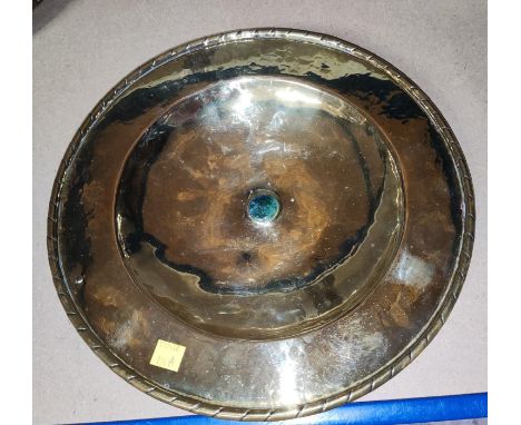 A brass Arts &amp; Crafts dish possibly Scottish&nbsp; with small central ceramic circle with twist rim, dia. 31cm 