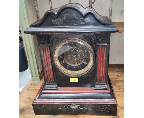 A large slate architectural cased mantel clock with columns in&nbsp; &nbsp;black and white dial 