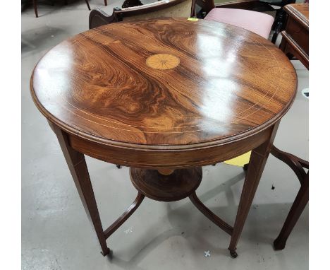 An Edwardian, inlaid rosewood circular occasional table with circular shelf underneath, on tapering legs. 