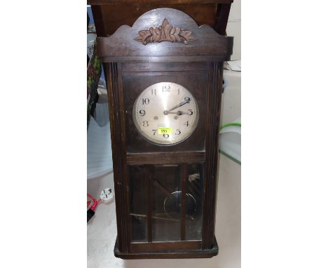 A 1930's oak striking wall clock; a Westminster chiming mantel clock and 3 vintage cameras. 