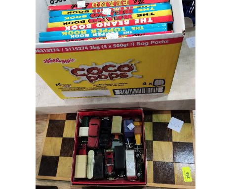 A selection of unboxed diecast cars, Dinky, Lledo etc; a coffee table resin chess set and board, children's annuals etc 