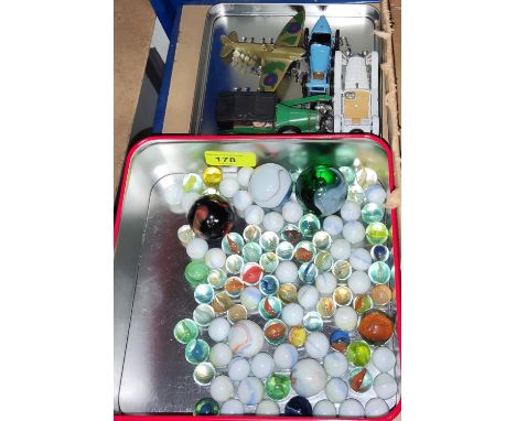 A collection of vintage marbles and a small selection of diecast vehicles 