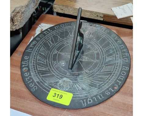 A weathered brass garden sundial, 20cm diameter 