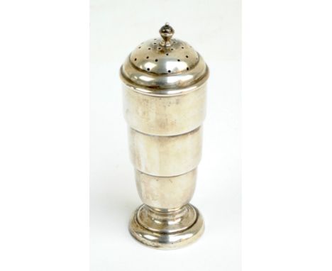 SANDERS & MACKENZIE; an Elizabeth II hallmarked silver Art Deco style sugar caster with pierced dome and cast finial, on spre