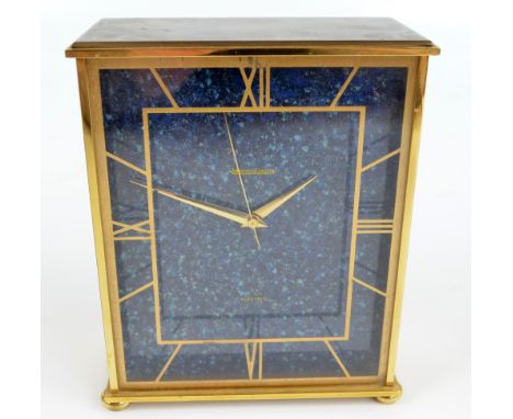 JAEGER LECOULTRE; a gilt metal electric mantel timepiece, the rectangular blue granite effect dial set with Roman numerals, o