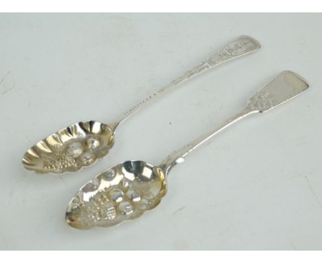 PROBABLY SOLOMON HOUGHAM; a George III hallmarked silver berry spoon with bright cut decoration including squirrel crest to f