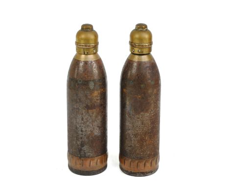 Two brass and steel empty shells bearing the military ordnance arrow and dated 1900, each height 18.5cm.   CONDITION REPORT: 