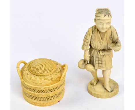 A Japanese Meiji period sectional ivory okimono of a water carrier holding a double gourd flask, scratched character marks to