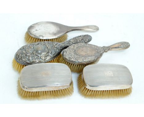 A group of hallmarked silver backed brushes including a matched pair of gentleman's brushes with linear engine turning, Birmi