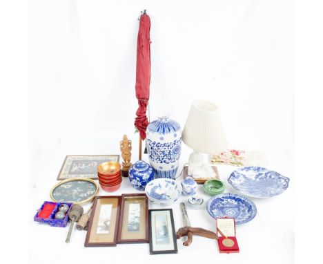 A quantity of oriental wares including blue and white blanc de chine lamp, parasol etc.