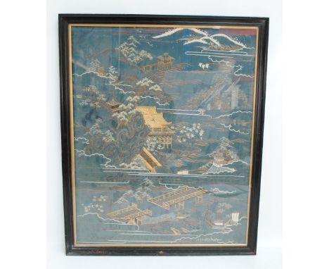 A large Chinese silk embroidery depicting architectural and mountainous landscape, 78 x 63cm, framed and glazed.