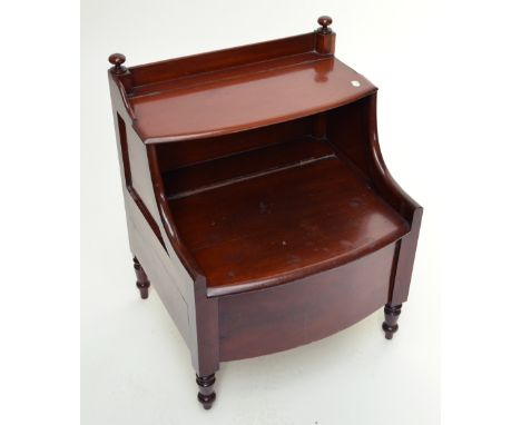 A 19th century mahogany bowfronted step commode with hinged seat and hinged upper section raised on ring turned legs, width 6