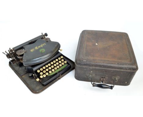 A cased 'The Empire' vintage typewriter.