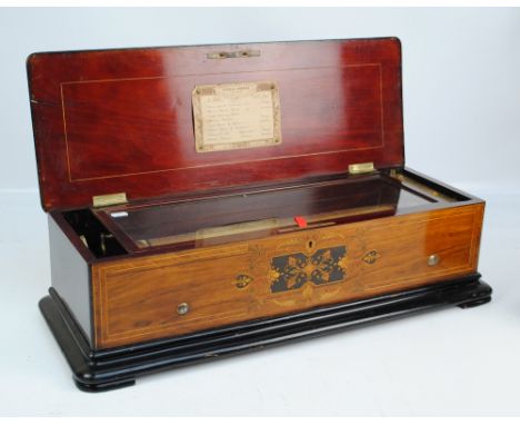 A c.1860 Nicole Freres of Geneva music box with eight airs, no.44058, in a mahogany case with satinwood stringing and kingwoo