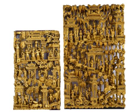 A Chinese gilt carved rectangular panel, finely decorated in relief with architectural landscape and numerous figures, 67.5 x