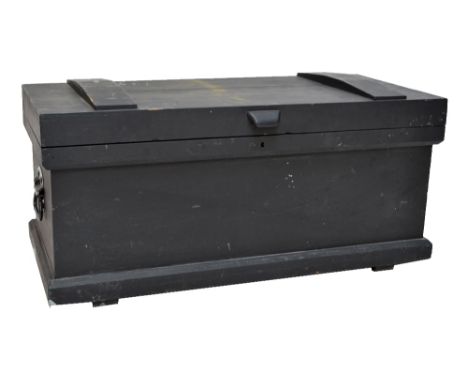 A black painted pine tool chest with hinged top enclosing interior with sections, pull outs, drawers, with green painted inte