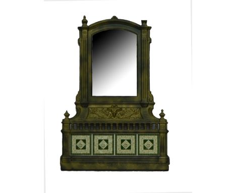 A 19th century Coalbrookdale style architectural mirror, the curved top flanked by finials above the plate, with ram's head a