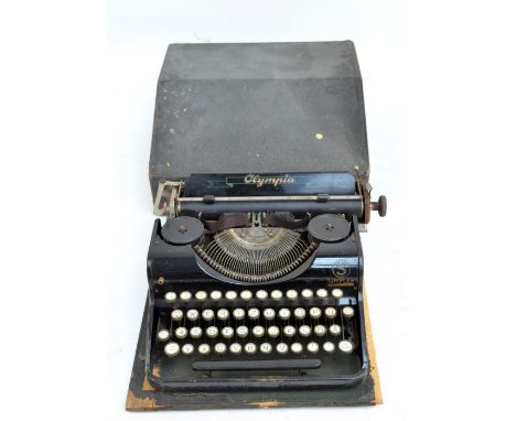 A cased vintage Olympia Simplex typewriter.