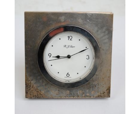 CARR'S OF SHEFFIELD LTD; an Elizabeth II hallmarked silver fronted square travelling clock, Sheffield 2000, 10 x 10cm.